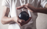 Person holding crystal ball - iStock-1168327797